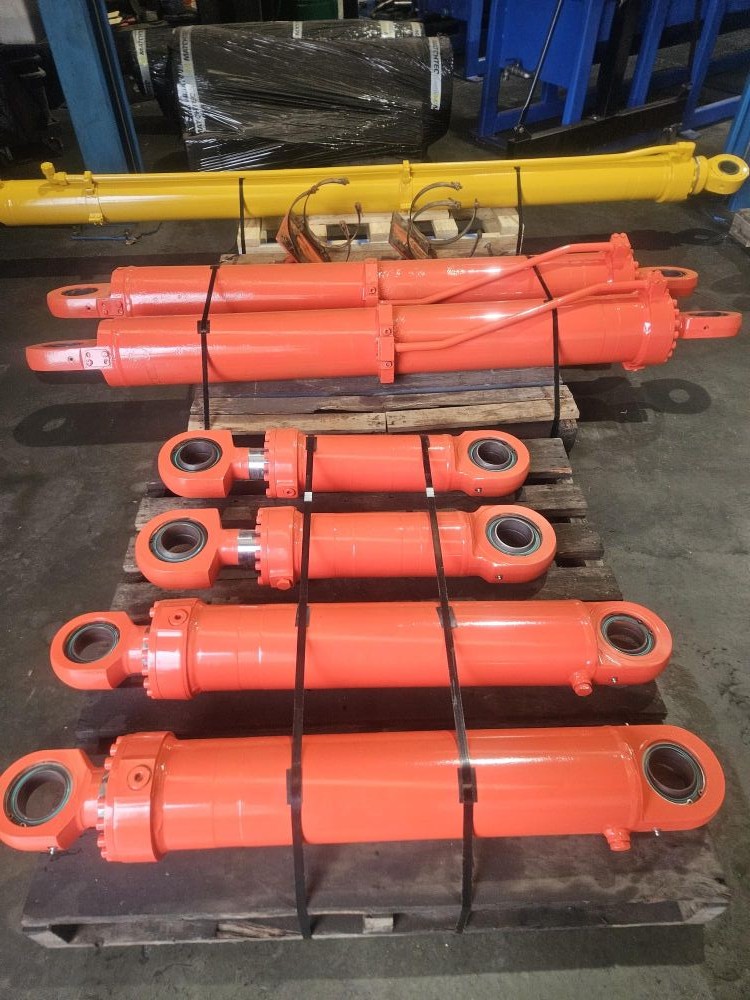 Finished red hydraulic cylinders prepared for delivery